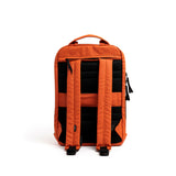 Mueslii travel backpack, made of PU coated waterproof nylon, with a laptop compartment, color orange, back view.