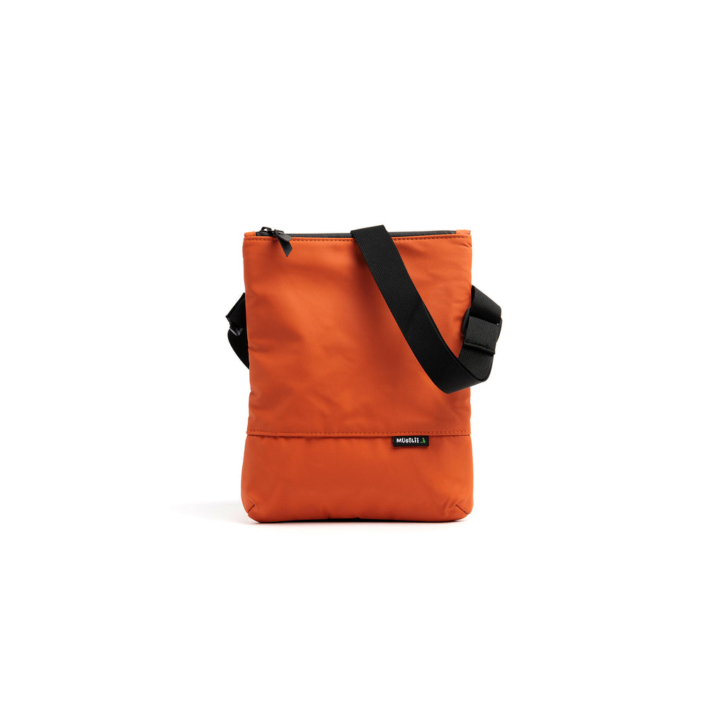 Mueslii crossbody, made of PU coated waterproof nylon, color burnt orange, front view.