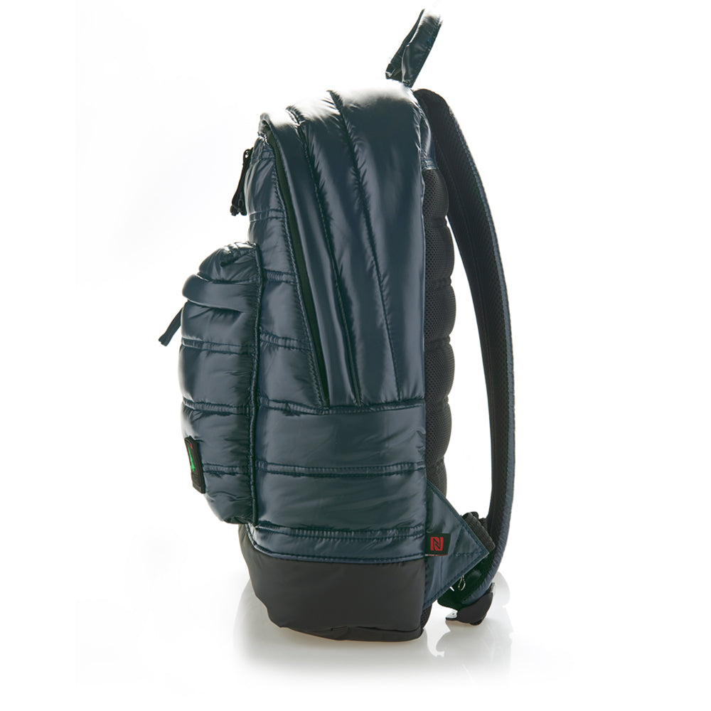 Mueslii original puffer laptop backpack made of high density nylon and Ykk zips, color  blue shiny, side view.